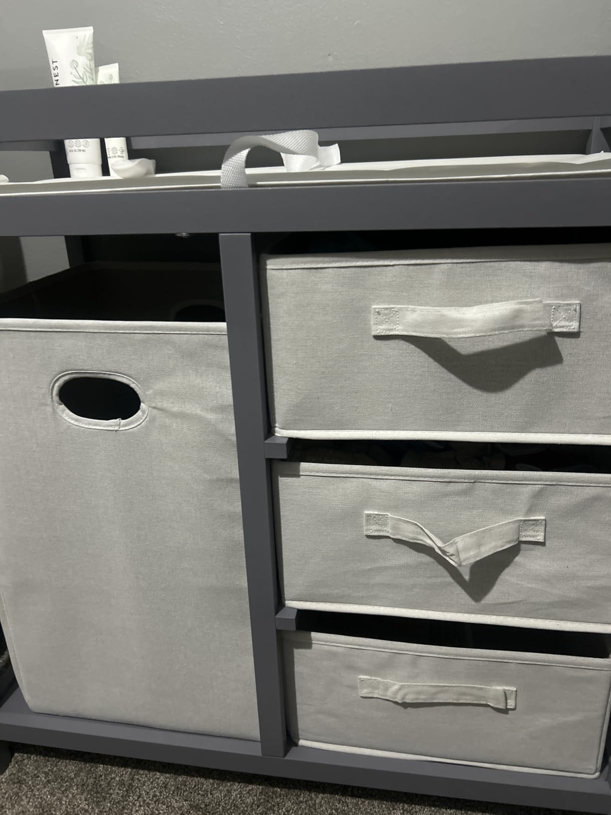 Badger Basket Modern Baby Changing Table - Nursery Furniture with Laundry Hamper and 3 Storage Drawers - Diaper Changing Station with Safety Belt, Changing Pad, and Organizer Baskets - Gray and White customer photo 2