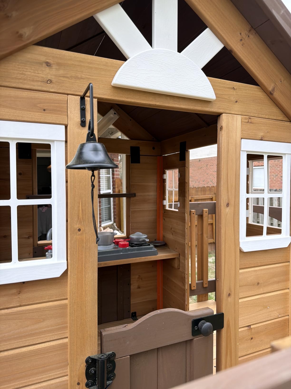 Backyard Discovery Echo Heights Elevated Cedar Wooden Kids Playhouse with Wave Slide, Play Kitchen, Wrap-Around Deck, Flat-Step Ladder, Half Door, Windows, Bell, and Growth Chart for Outdoor Play customer photo 1