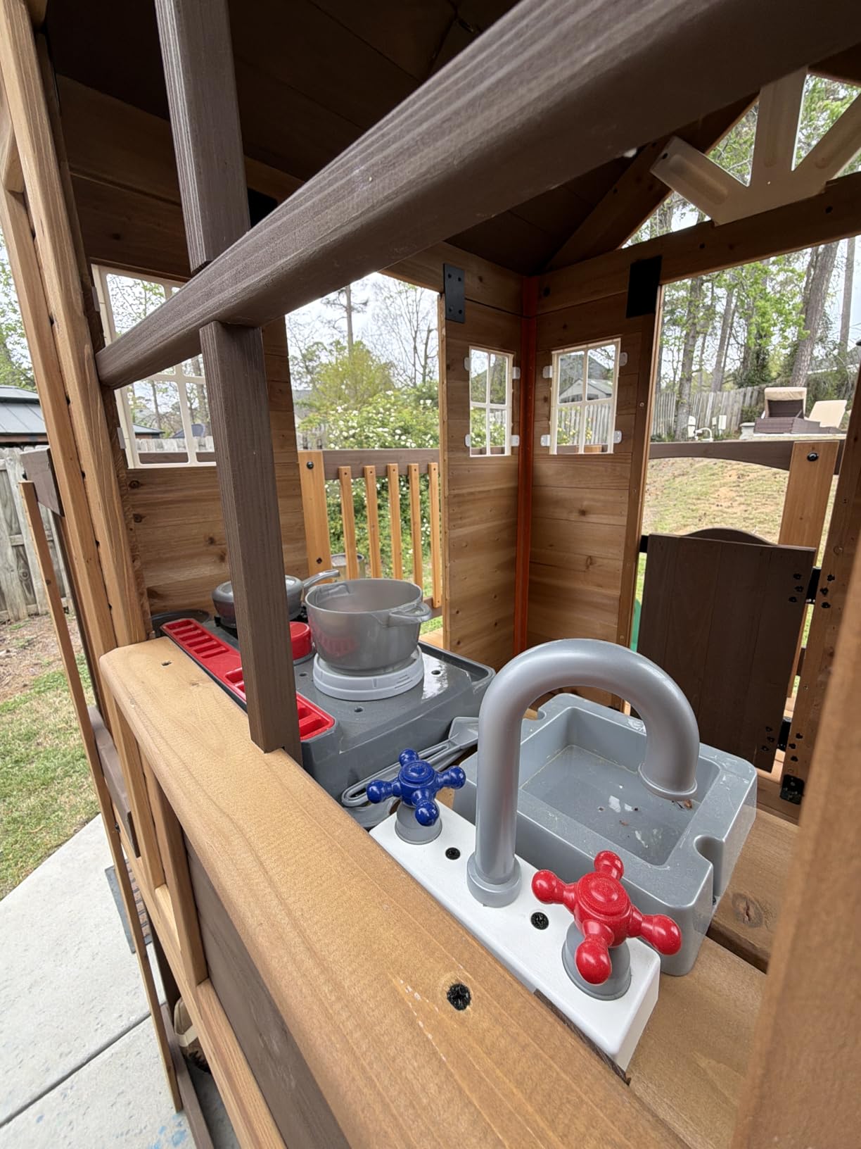 Backyard Discovery Echo Heights Elevated Cedar Wooden Kids Playhouse with Wave Slide, Play Kitchen, Wrap-Around Deck, Flat-Step Ladder, Half Door, Windows, Bell, and Growth Chart for Outdoor Play customer photo 2