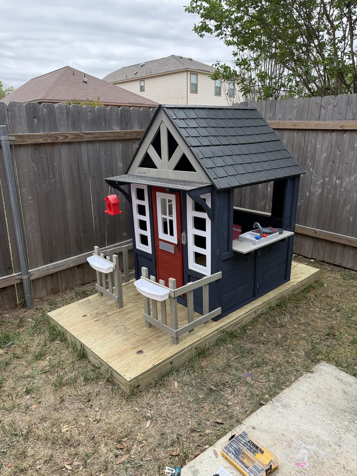 KidKraft Riverscape Wooden Playhouse with Working Doorbell, Fence, Kitchen and Pet Door customer photo 1