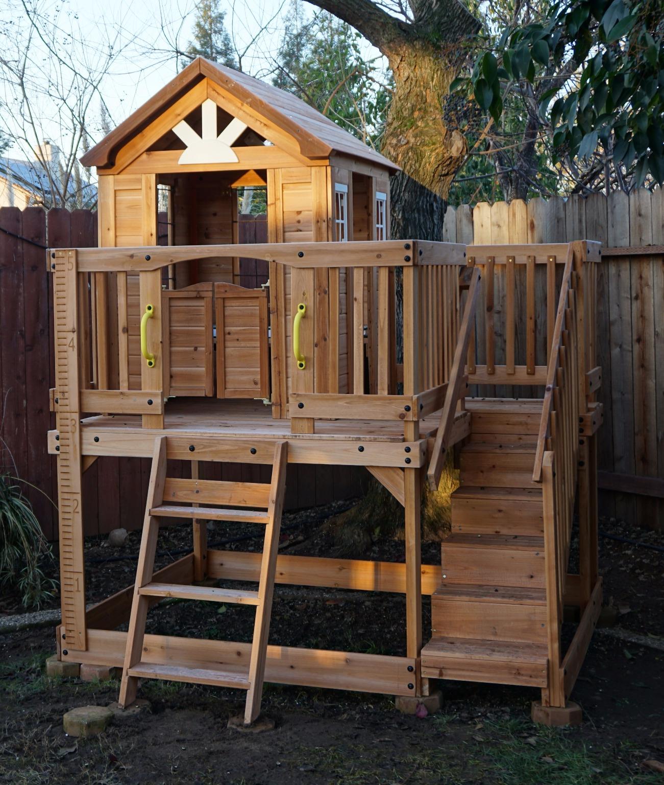 Backyard Discovery Scenic Heights Elevated Cedar Wooden Kids Playhouse with Play Kitchen, Wrap-Around Deck, Toy Storage Bench, Saloon-Style Doors, Ladder, Stairs, and Growth Chart for Outdoor Play customer photo 2
