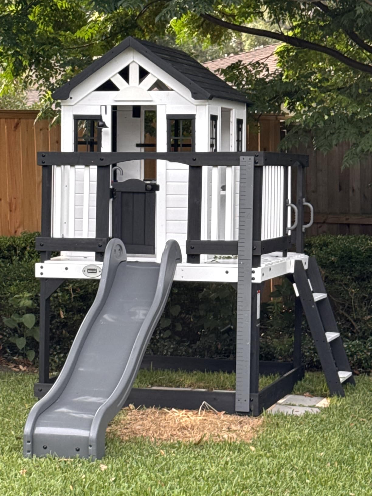 Backyard Discovery Sweetwater Heights White Elevated Cedar Wooden Kids Playhouse with Wave Slide, Play Kitchen, Step Ladder, Half Door, Wrap-Around Deck, Windows, Bell, Growth Chart for Outdoor Play customer photo 1