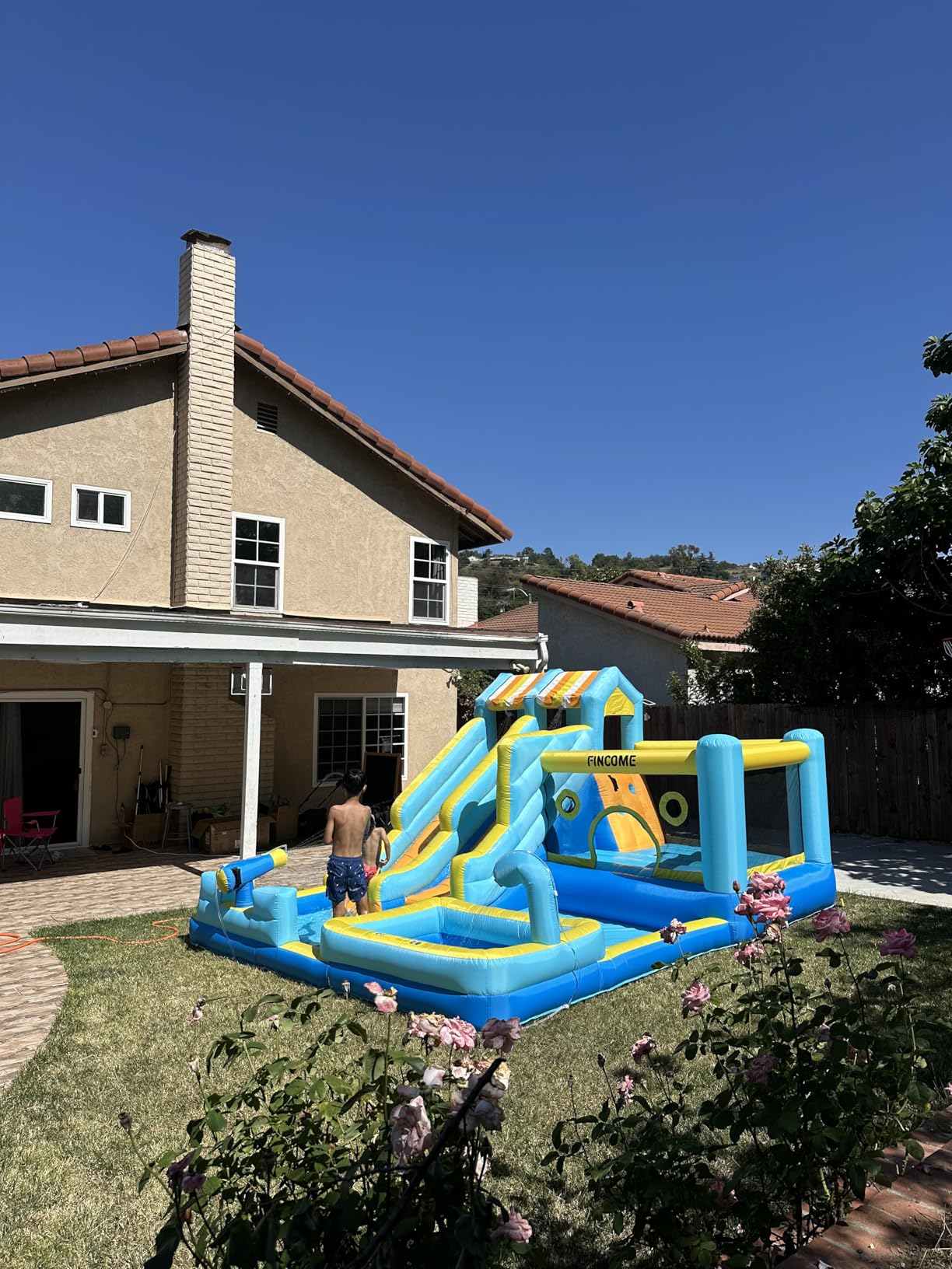 FINCOME Inflatable Bounce House, 10 in 1 Double Water Slide Bounce House with 750W Blower, Climbing Wall, Jumping, Water Gun, Splash Pool, Basketball Hoop for Kids Indoor Outdoor Backyard customer photo 1
