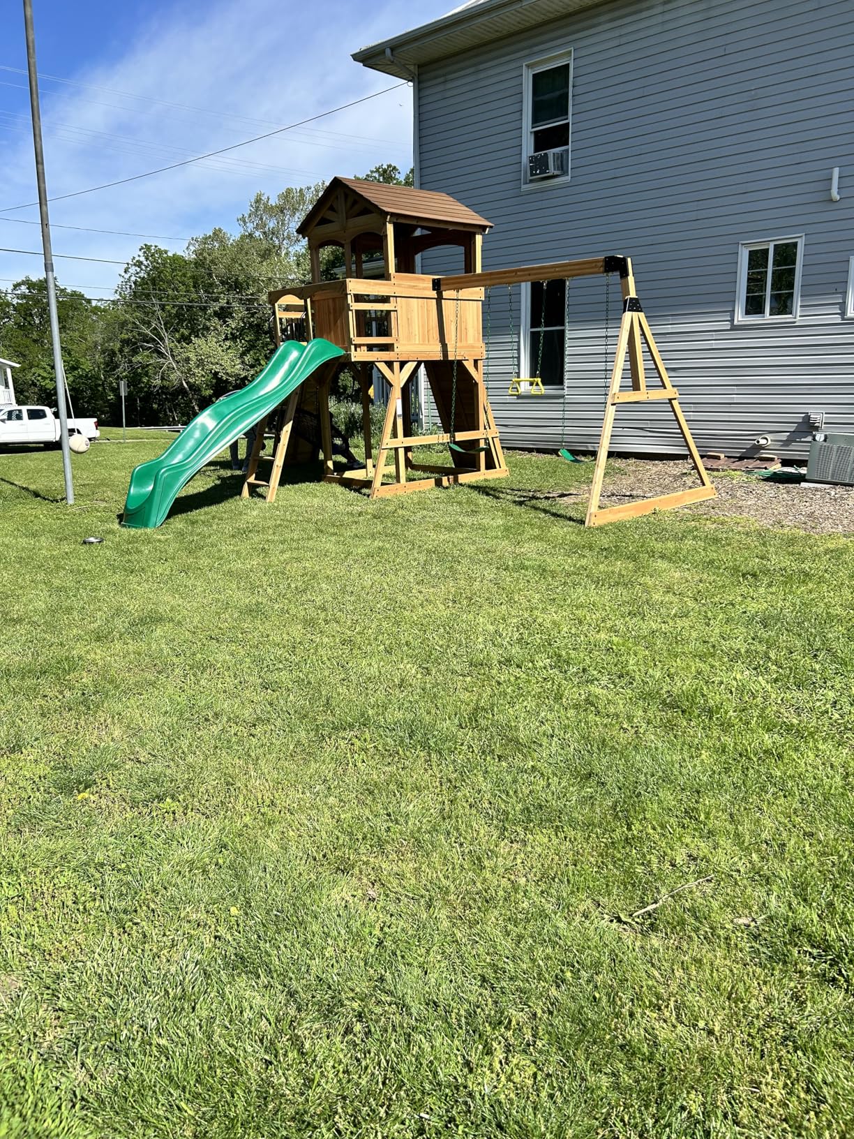 Backyard Discovery Dover Bay Spruce Wood Swing Set with Wave Slide, Clubhouse, Monkey Bars, Rock Wall, Belt Swings, Step Ladder, Toy Telescope, Chalkboard, Outdoor Playset customer photo 1