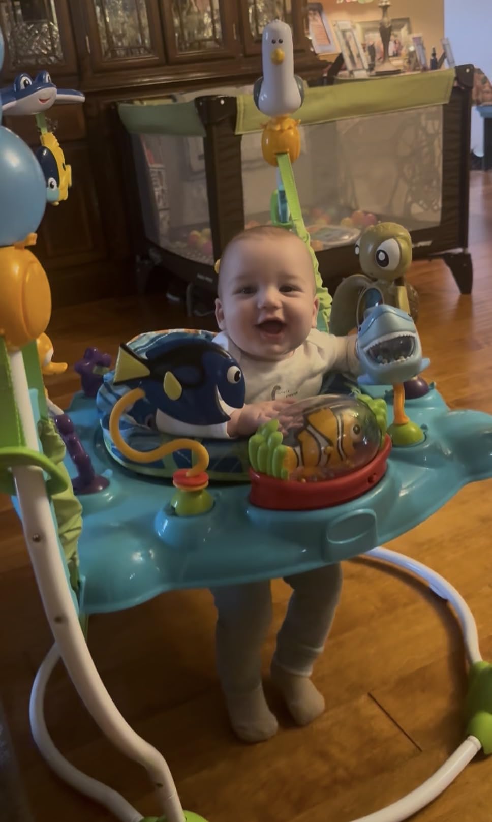 Bright Starts Disney Baby Finding Nemo Sea of Activities Baby Activity Center Jumper with Interactive Toys, Lights, Songs & Sounds, 6-12 Months (Blue) customer photo 2