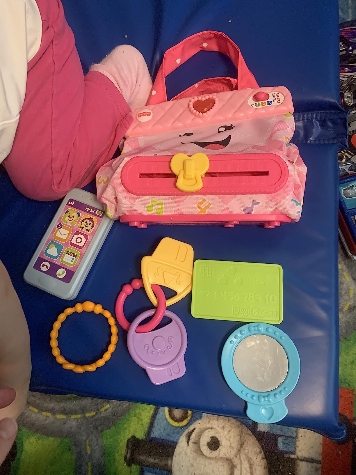 Fisher-Price Baby & Toddler Toy Laugh & Learn My Smart Purse with Lights, Learning Songs & 5 Accessories for Infants Ages 6+ Months (Amazon Exclusive) customer photo 2