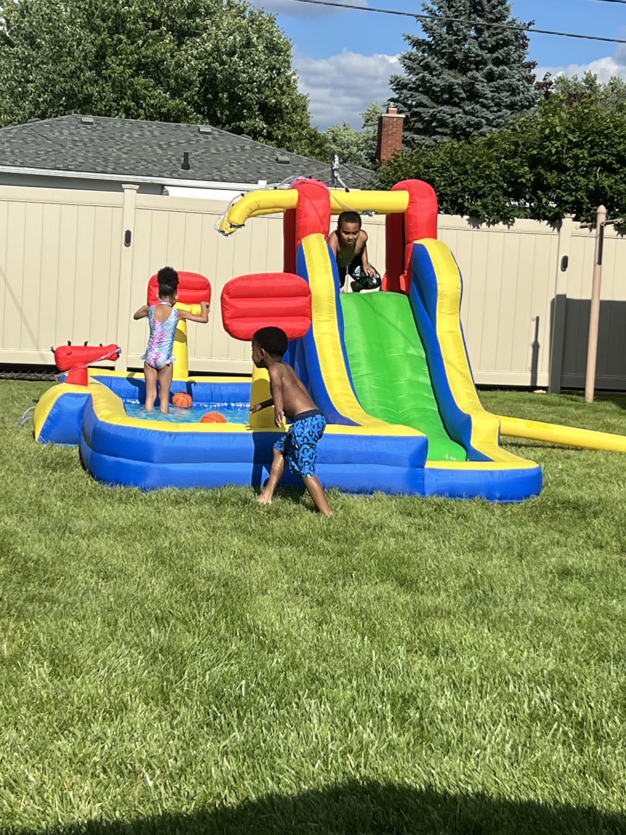 WELLFUNTIME Inflatable Water Park with Blower, Bouncy Castle with Water Cannon and Double Basketball Rings customer photo 1