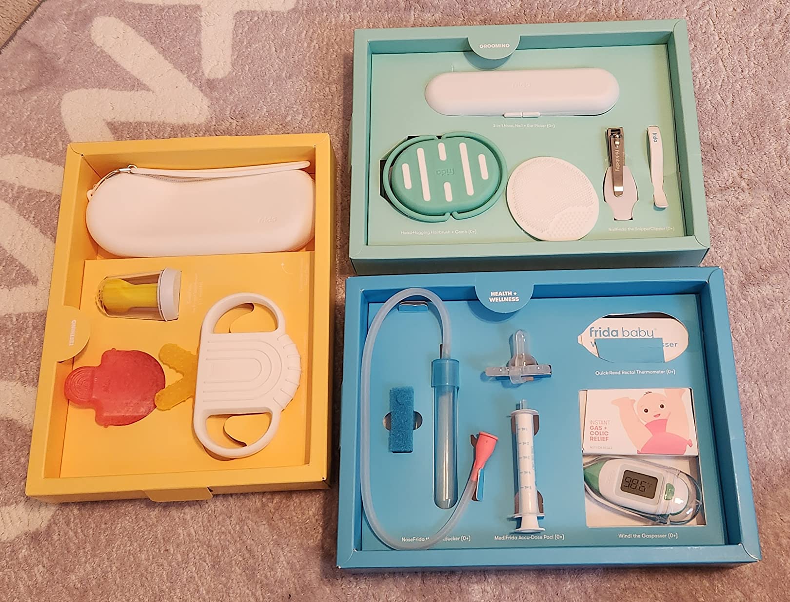 Frida Baby Ultimate Baby Kit, 10 piece New Born Essentials Gift Set Includes Wellness Sick Day, Gas Relief, Grooming Tools & Teething Toys customer photo 1