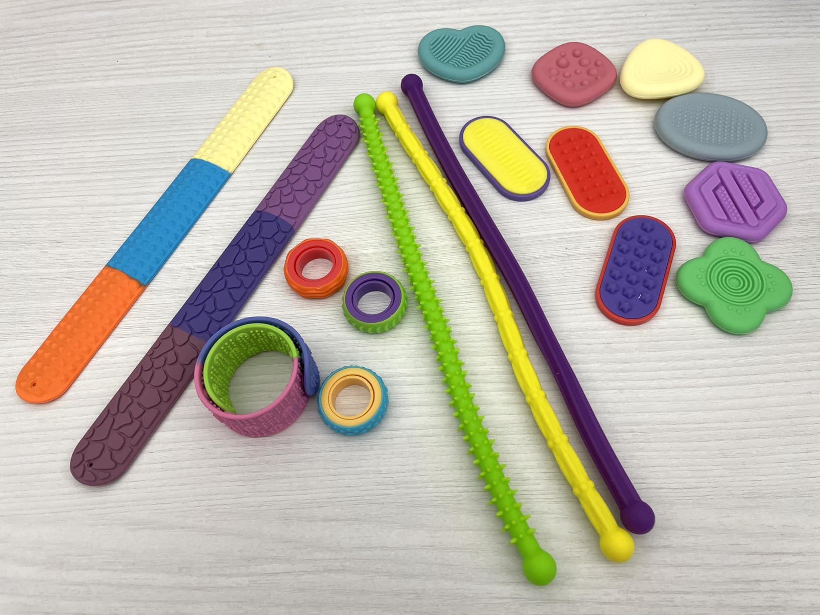 JOYIN 18 PCS Silicone Fidget Toys Set, Quiet Silicone Sensory Toys for Kids & Adults, Stress Relief Pack with Sensory Stones, Fidget Rings, Push Boards, Stretchy Strings & Textured Wristbands customer photo 1
