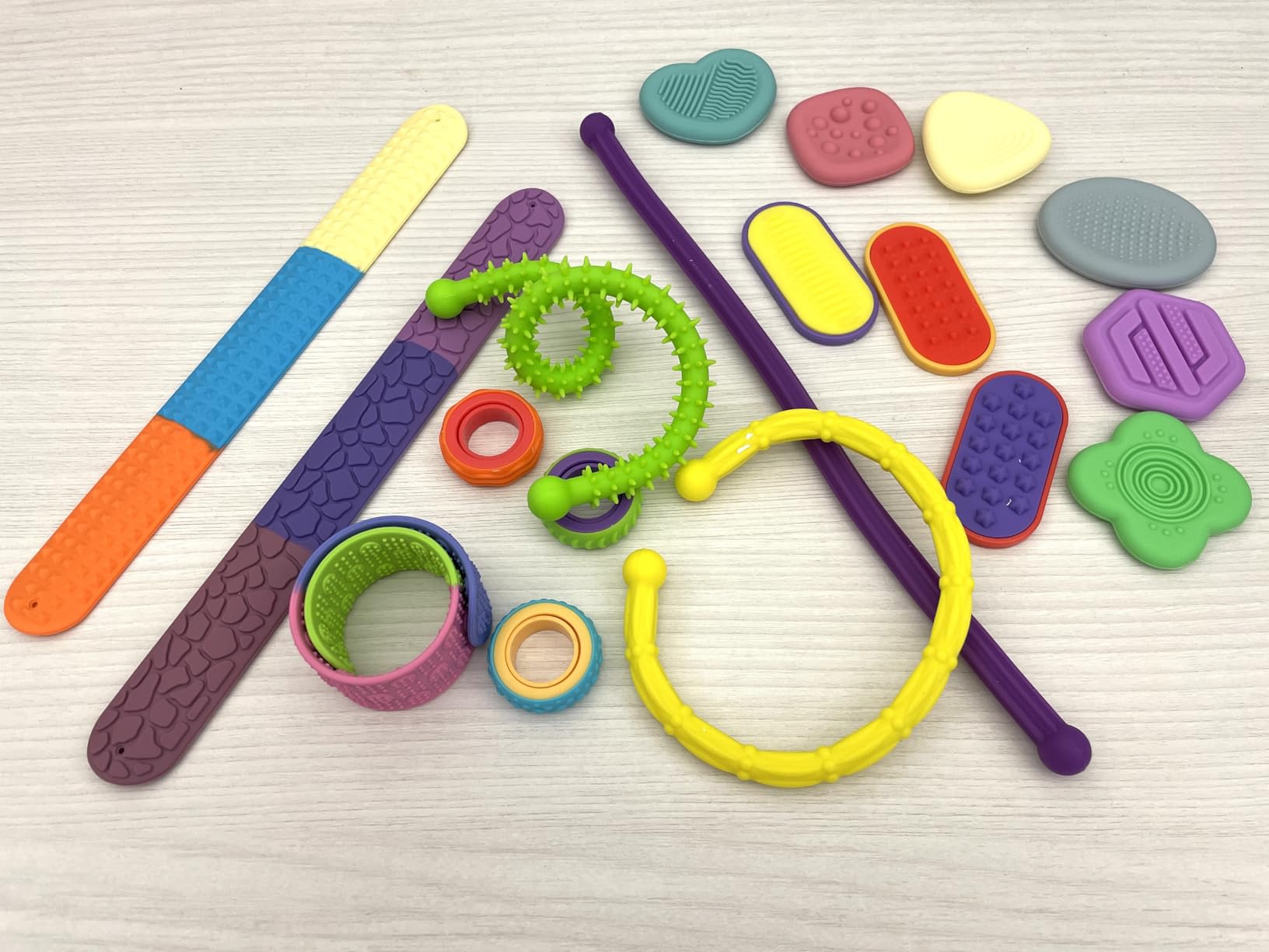 JOYIN 18 PCS Silicone Fidget Toys Set, Quiet Silicone Sensory Toys for Kids & Adults, Stress Relief Pack with Sensory Stones, Fidget Rings, Push Boards, Stretchy Strings & Textured Wristbands customer photo 2