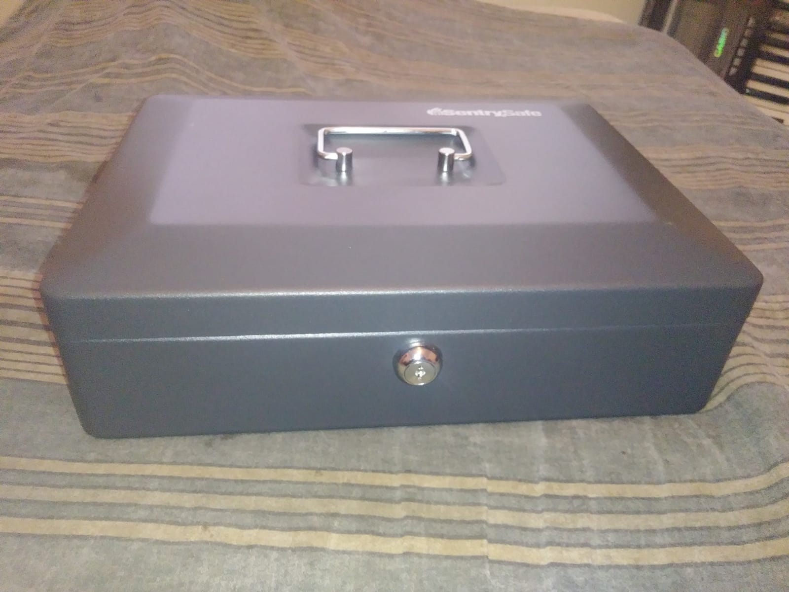 SentrySafe Black Money Saving Box with Cash Tray and Key Lock, Portable Safe Box with Carrying Handle, 0.21 Cubic Feet, 3.75 x 12 x 9.3 Inches, CB-12 customer photo 1