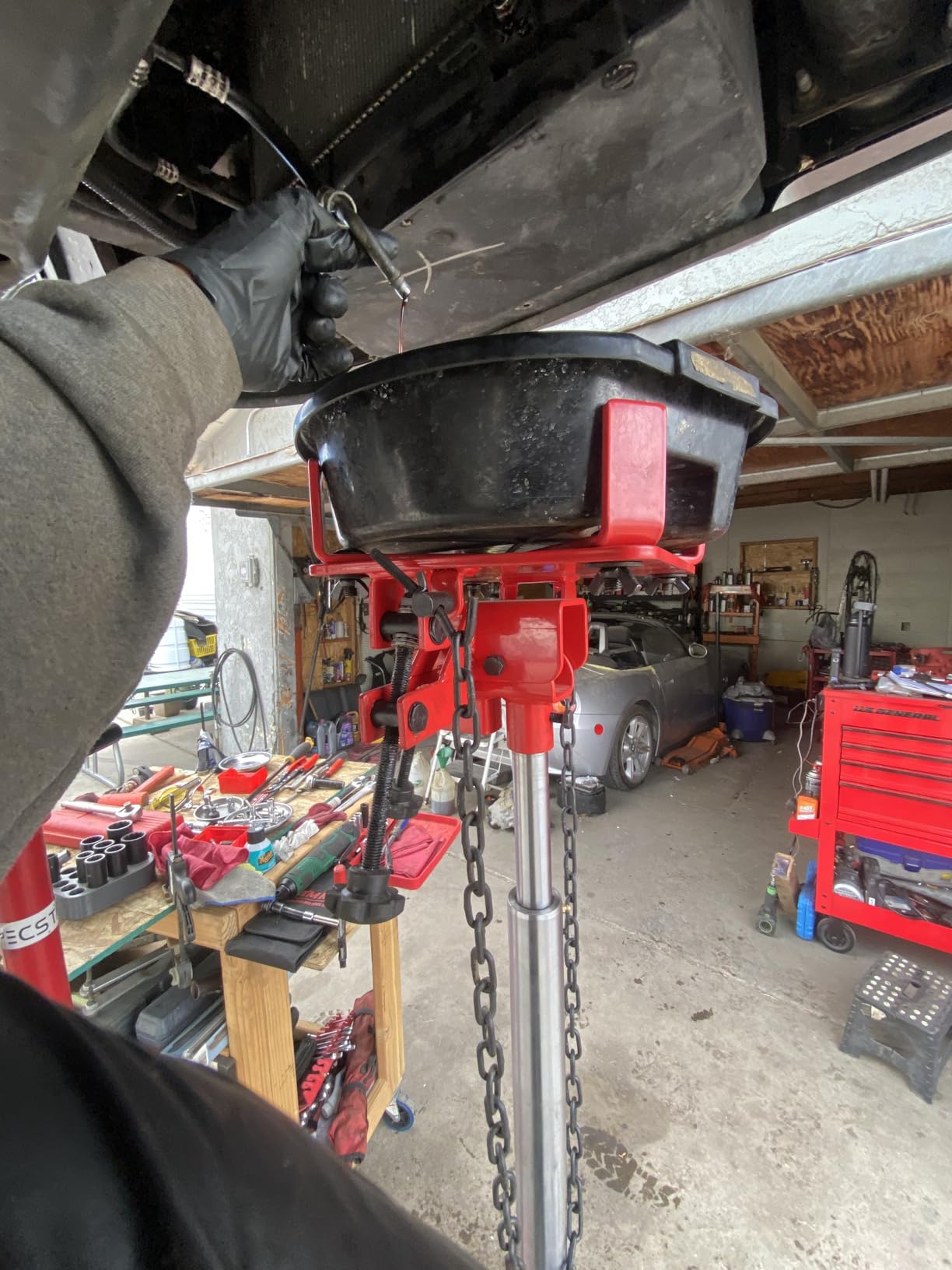 Sunex Tools 7793B 1,000 lb Telescopic Transmission Jack, Hydraulic, Foot Pump Operated, Tilt Saddle with Chain Tie-Down, 74.2 in Max Height customer photo 2