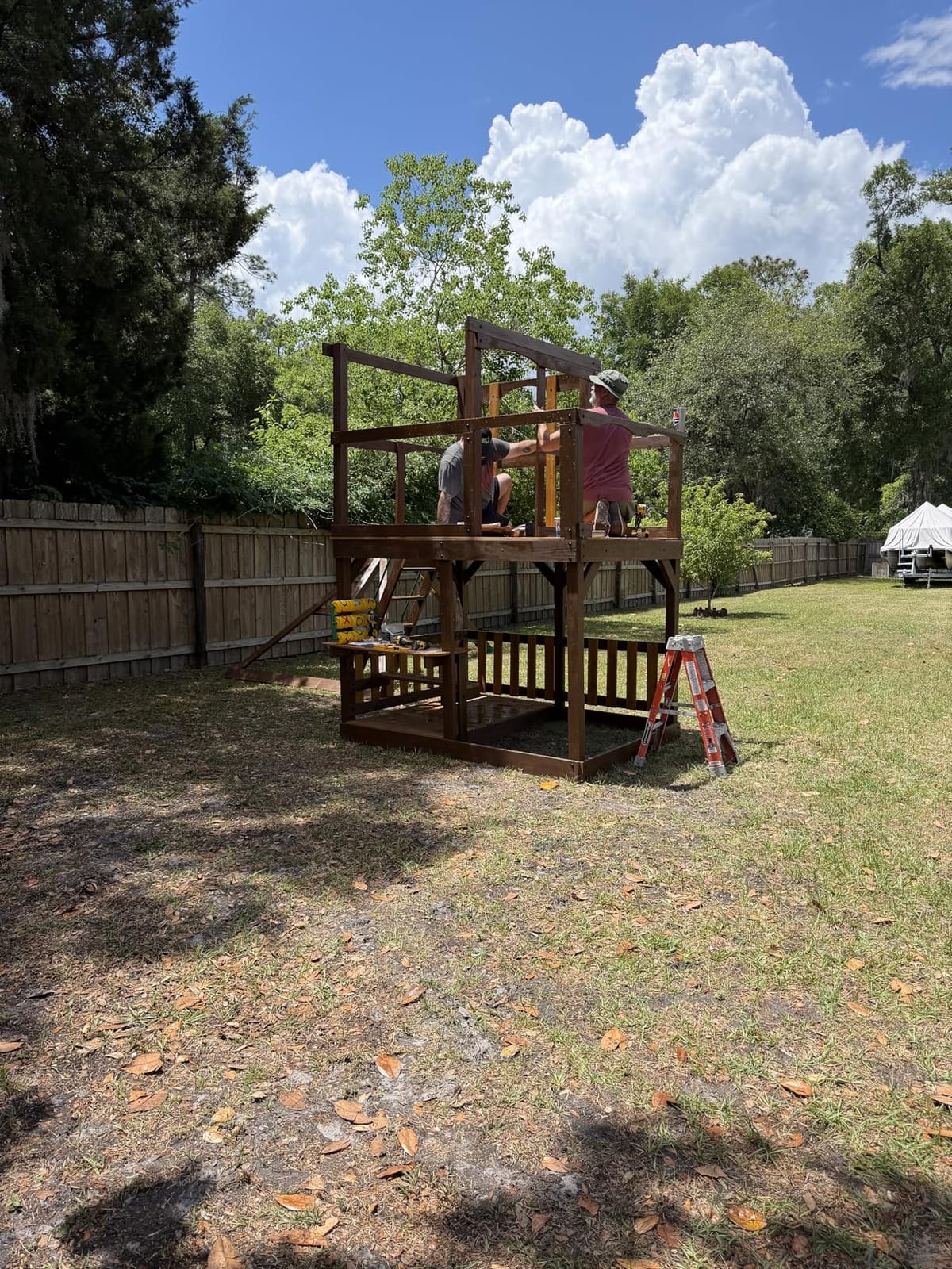 Backyard Discovery Skyfort All Cedar Swing Set, Elevated Covered Wood Roof Clubhouse with Bay Windows, 2 Belt Swings, Web Swing, 10ft Wave Slide, 5 ft Tube Slide, Covered Picnic Table, 5 ft Rock Wall customer photo 2