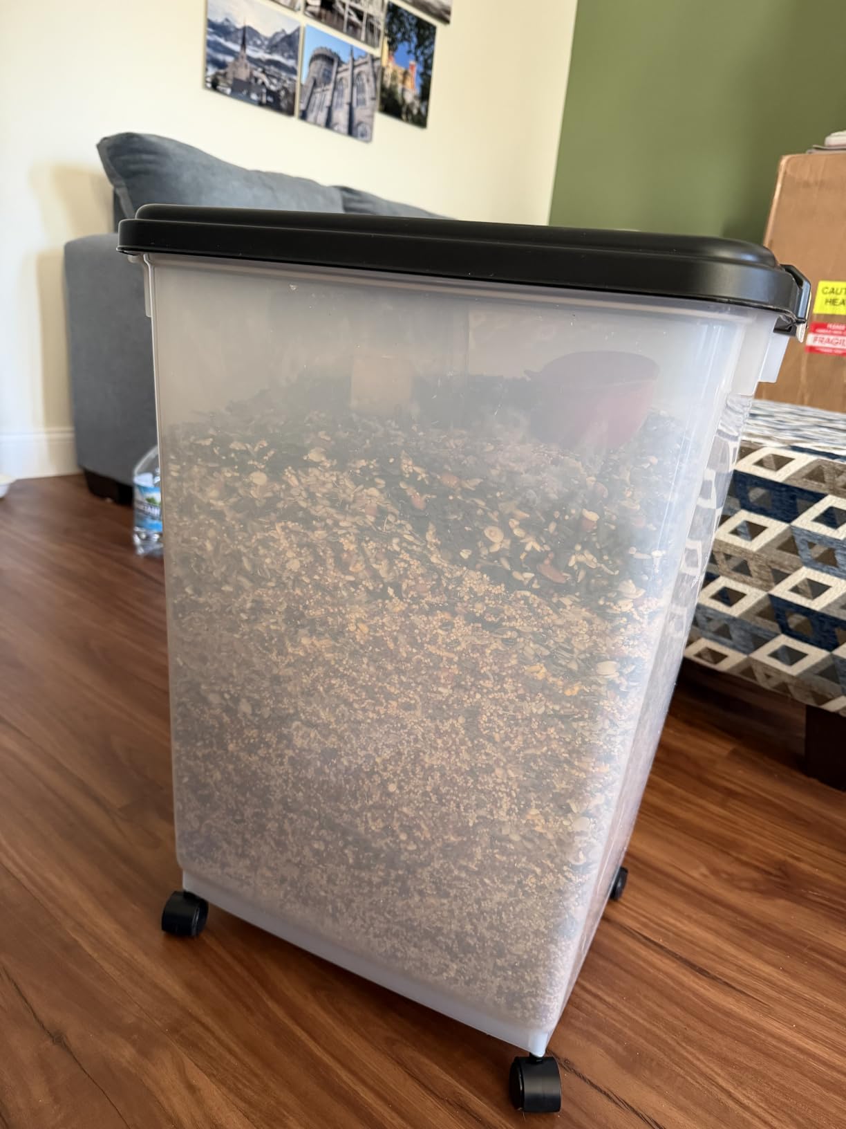 IRIS USA Airtight Pet Food Storage Rolling Container, 30 lb Capacity, Black | Airtight seal keeps kibble, bird seed, and pet food fresh while wheels provide easy mobility around the home. customer photo 1