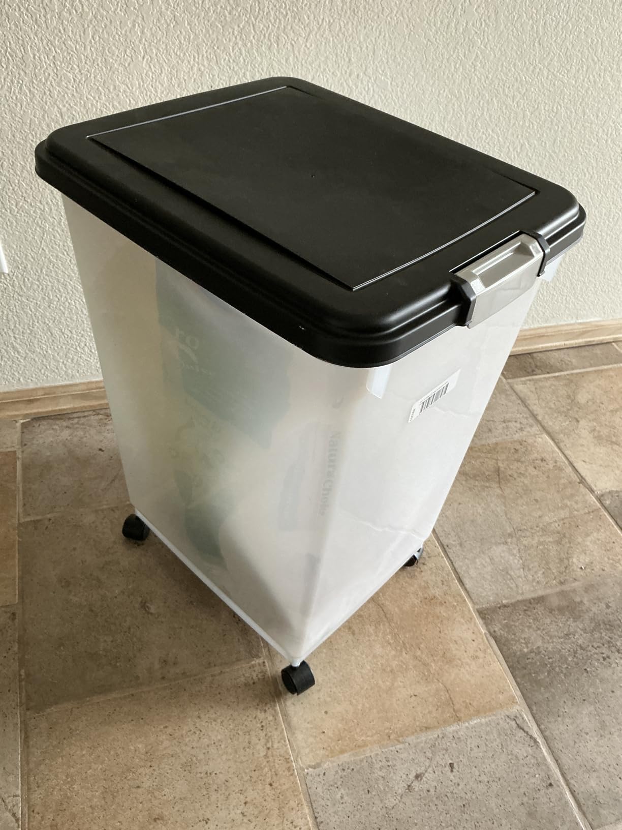 IRIS USA Airtight Pet Food Storage Rolling Container, 30 lb Capacity, Black | Airtight seal keeps kibble, bird seed, and pet food fresh while wheels provide easy mobility around the home. customer photo 2
